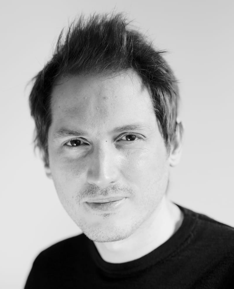 Black and white headshot portrait of Jano Garcia